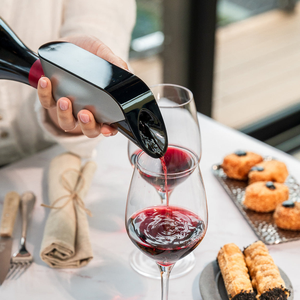 Aveine Original wine aerator mounted on an open bottle